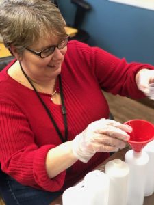 Paula McGinnis of Klingensmiths Drug Store in New Bethlehem PA helps produce hand sanitizer for COVID-19